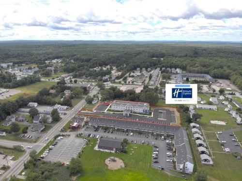 an aerial view of a parking lot with a building at Holiday Inn Express - Wells-Ogunquit-Kennebunk by IHG in Wells