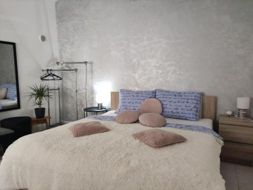 a bedroom with a bed with two pillows on it at Little Paradise in Pula