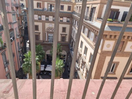 a view of a building from behind a fence at BARBAJA SUITES IN STREET TOLEDO 205 in Naples
