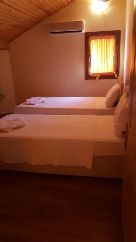 Ένα ή περισσότερα κρεβάτια σε δωμάτιο στο Sunset Apart Otel