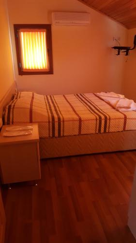 Ένα ή περισσότερα κρεβάτια σε δωμάτιο στο Sunset Apart Otel