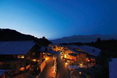 a view of a street at night with lights at Bettei Soan in Minami Aso