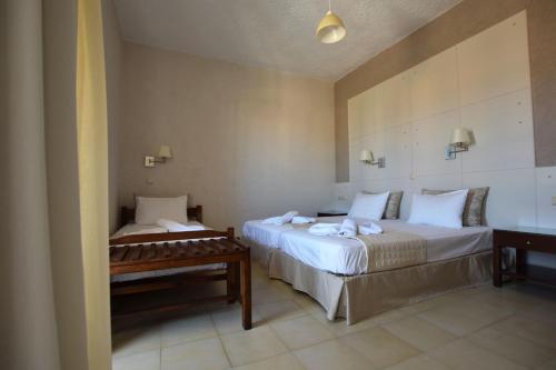 Postel nebo postele na pokoji v ubytování Altis Hotel