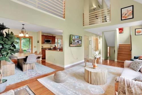 a living room with a couch and a table at Massanutten retreat- hiking, river, waterpark, resort in McGaheysville