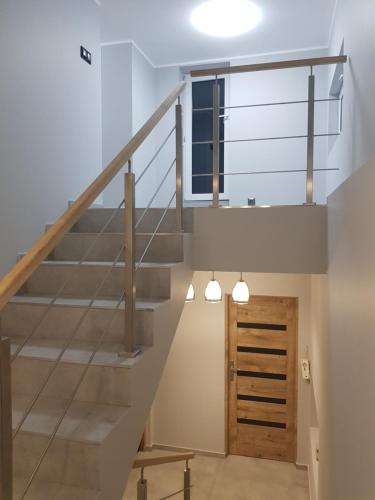 a staircase in a house with a stair case at Noclegi Jaworzno in Jaworzno