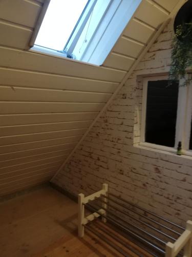 a staircase in a room with a window at Ochsenhof in Feuchtwangen