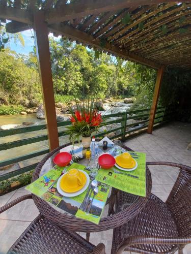 a table with plates of food on a patio at Repousada Sana in Sana