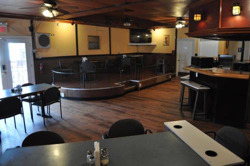 an empty restaurant with tables and chairs and a bar at K7 Bed and Breakfast in Pahrump