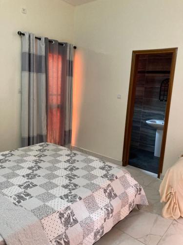 Ένα ή περισσότερα κρεβάτια σε δωμάτιο στο Maison Oceane a Zac MBAO
