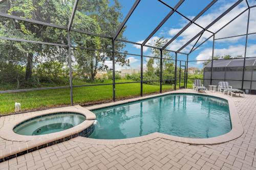 The swimming pool at or near Beautiful Luxury 2 Story Home in Windsor Hills! 2 Miles from Disney! villa