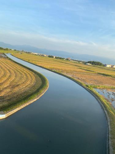 an aerial view of a river in a field at Sunny Villa Homestay in Wujie