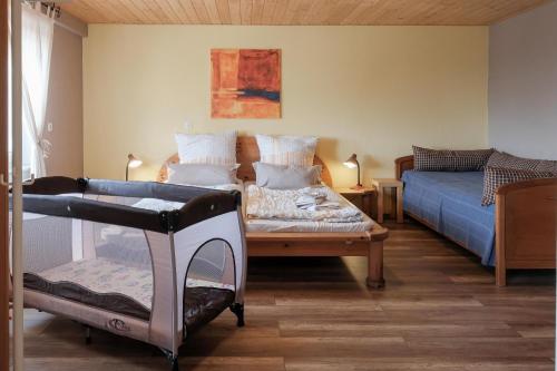 Postel nebo postele na pokoji v ubytování Ferienwohnung Liebelt in Mitgenfeld , bayerische Rhön