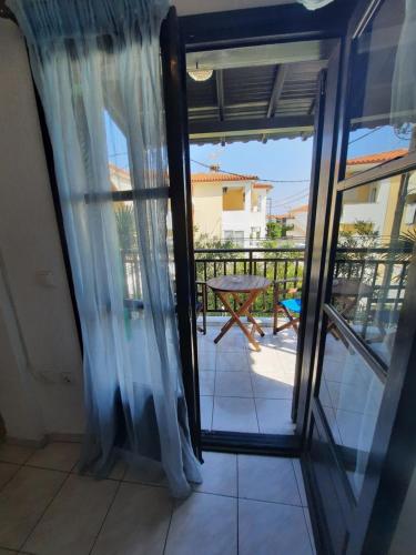 a view of a balcony from a room with a window at Tassos 2 in Pefkohori