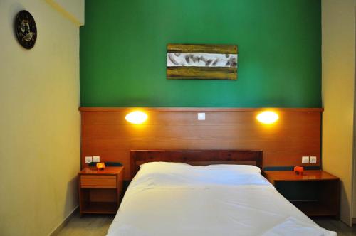 Ένα ή περισσότερα κρεβάτια σε δωμάτιο στο Ionian Paradise