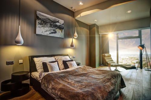 Postel nebo postele na pokoji v ubytování Apartamenty Sky Tower