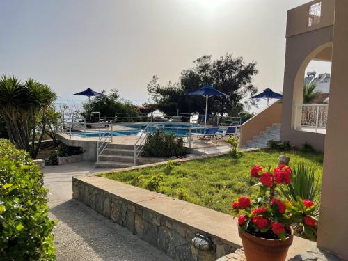 a view of a resort with a swimming pool at Nostalgia Villas in Tersanas