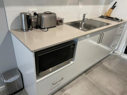 a white stove top oven sitting in a kitchen at Jesmond Executive Villas in Newcastle