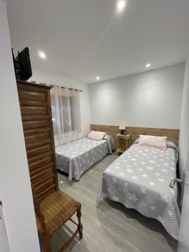 Кровать или кровати в номере Chalet xeitosiño