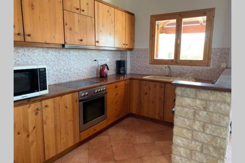 Kuchyň nebo kuchyňský kout v ubytování Villa Yucca Palm