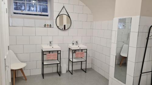 a bathroom with two sinks and a mirror at Safestay York in York