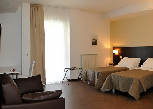En eller flere senger på et rom på Le Stanze Sul Corso