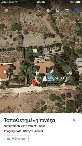 a map of a house with a red marker at Luxury villa with stunning panoramic sea view in Keratea