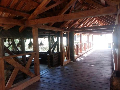 a wooden floor in a building with a wooden ceiling at Cheremosh in Yablunytsya