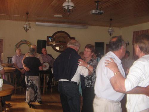 a group of people dancing in a room at Ravine Hotel in Lisdoonvarna