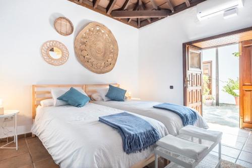 מיטה או מיטות בחדר ב-La Huertita de Arona Tenerifesummervillas