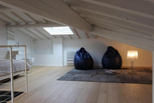 a room with two black bean bags sitting on the floor at Dame di Toscana in Lastra a Signa