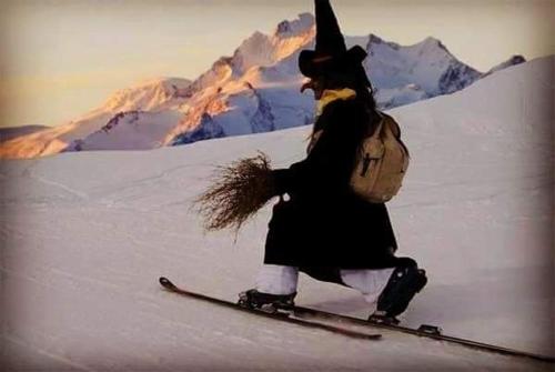 a woman on skis in the snow with mountains in the background at HOME SWEET HOME in Antey-Saint-André