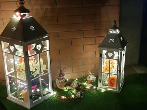 two lanterns with christmas lights on the ground at Le Chat a Pois in Aosta