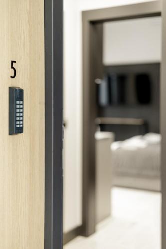 a door with the number on it in a room at Apartamenty L11, Limanowskiego in Poznań