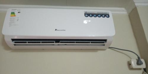 a air conditioner is attached to a wall at Boel Boutique Suite en Guayaquil in Guayaquil