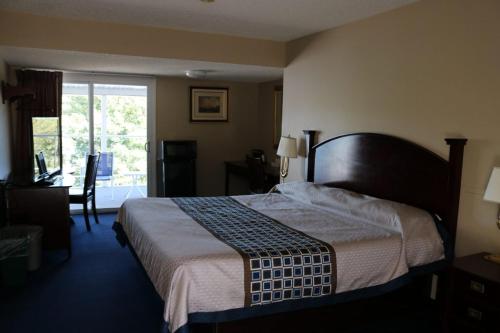 Un pat sau paturi într-o cameră la The Anchor Inn