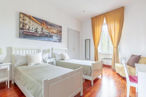 Кровать или кровати в номере Leonardo Suite Navona