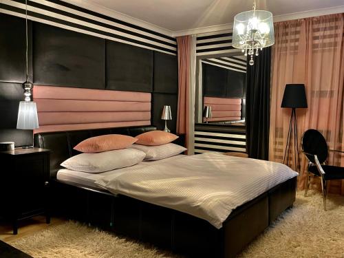 Voodi või voodid majutusasutuse Boutique Hotel Massimos toas