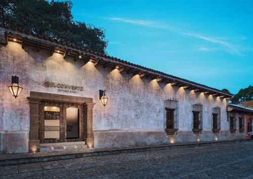 a building with lights on the side of a street at El Convento Boutique Hotel in Antigua Guatemala