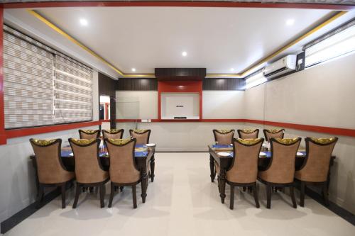 a conference room with a table and chairs at Hotel Star Bodh Gaya in Bodh Gaya