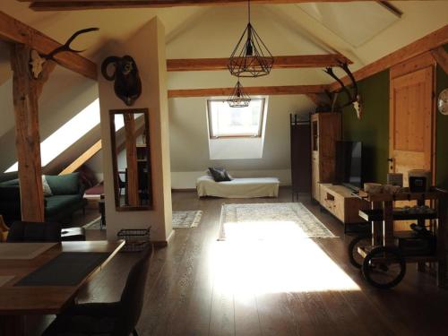 a living room with a couch and a table in a room at Ferienhaus "Platzhirsch" in Hollenstein an der Ybbs