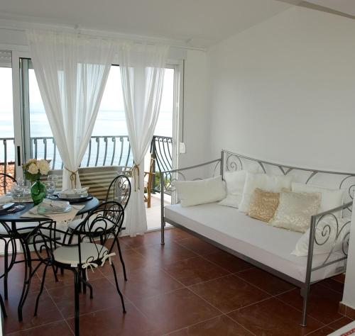 a living room with a couch and a table at Apartments Issa in Makarska