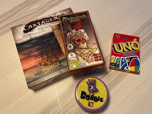 a board game and a monopoly and a dvd and a boardgame at Super central - appartement 2,5pcs à Leukerbad in Leukerbad