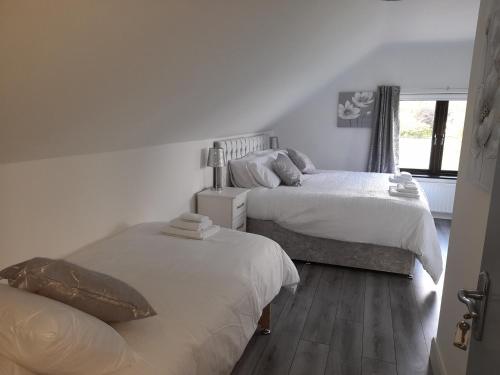 Postel nebo postele na pokoji v ubytování Glenbeg Lodge B&B