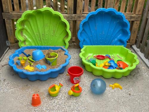 three play sets with toys on the ground at Apartment WELLNESS Vlčková in Vlčková
