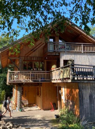 a house being constructed with a wrap around deck at Les deux loups in Samoëns