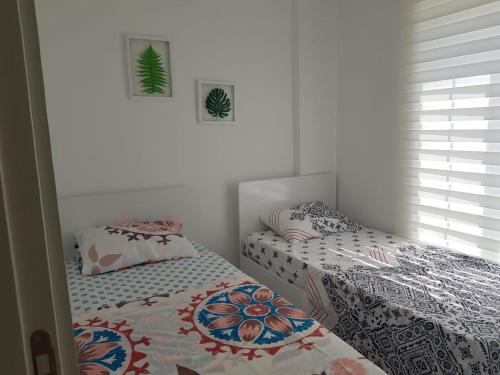 Кровать или кровати в номере BELKA GOLF RESİDENCE Dublex BELEK