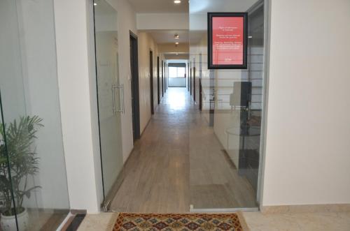 a corridor of an office building with a hallway at Lords Eco Inn Belagavi in Belgaum