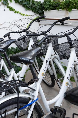 a group of bikes parked next to a building at Club Azzurro Hotel & Resort in Porto Cesareo