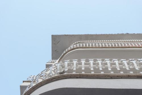 a metal staircase on the side of a building at Club Azzurro Hotel & Resort in Porto Cesareo