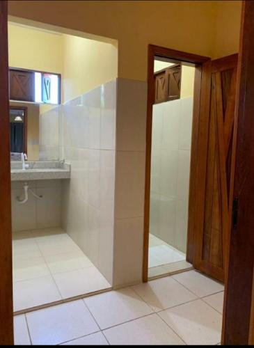 a bathroom with a shower and a sink at Agualinda Hotel in Alter do Chao
